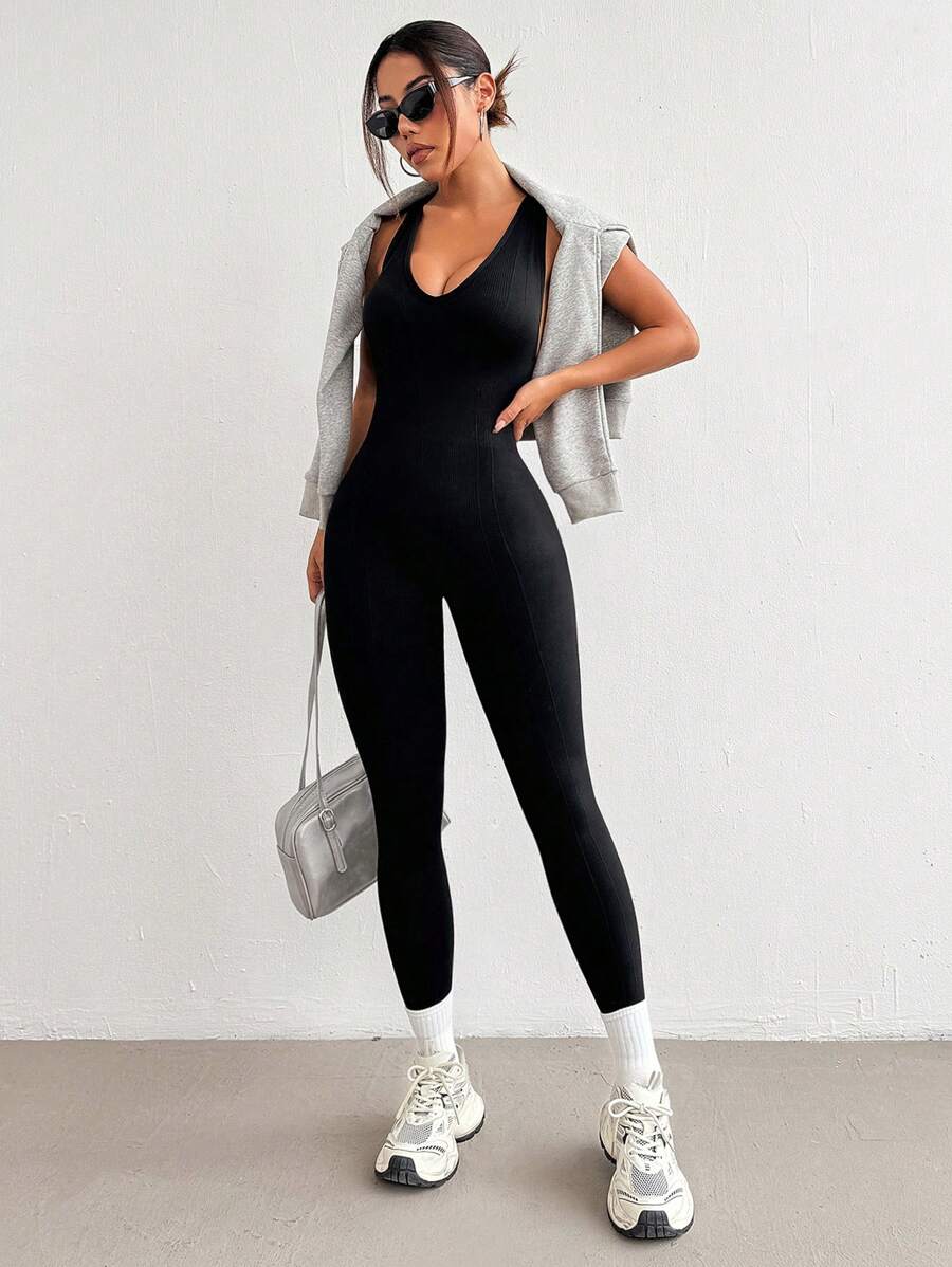 Mono deportivo ajustado con espalda cruzada
